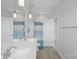 Bathroom featuring double sinks, modern fixtures, and a separate shower area at 1390 Cedardale Ln, Denver, NC 28037