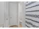 Bathroom features a white shower curtain and tile flooring, complementing the white walls at 1390 Cedardale Ln, Denver, NC 28037