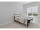 This bedroom with natural light and neutral walls is perfect for any lifestyle at 1390 Cedardale Ln, Denver, NC 28037