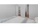 Bedroom featuring a neutral palette with closet and bathroom access at 1390 Cedardale Ln, Denver, NC 28037