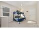 Bright bedroom featuring a bunk bed, white trim, and neutral carpet at 1390 Cedardale Ln, Denver, NC 28037