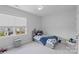 Bright bedroom featuring a comfortable bed and a view of the neighborhood at 1390 Cedardale Ln, Denver, NC 28037