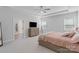 Spacious bedroom features a trey ceiling, a ceiling fan, large windows and access to the ensuite bathroom at 1390 Cedardale Ln, Denver, NC 28037