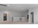 This spacious bonus room with plenty of lighting provides ample space to gather and relax at 1390 Cedardale Ln, Denver, NC 28037