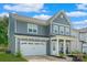 Charming two-story home featuring a two-car garage, covered porch and manicured lawn in a Gathering-friendly neighborhood at 1390 Cedardale Ln, Denver, NC 28037