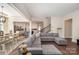 Spacious living room featuring hardwood floors, a large gray sectional sofa, and an open layout at 1390 Cedardale Ln, Denver, NC 28037