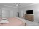 Inviting main bedroom features soft carpet, dresser, tray ceiling, and a neutral color scheme at 1390 Cedardale Ln, Denver, NC 28037