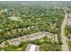 Overhead view of a residential area with lush green trees, and a clear view of the golf course at 14457 Adair Manor Ct, Charlotte, NC 28277