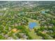 Breathtaking aerial view of a golf course community featuring lush greenery, serene ponds, and beautiful homes at 14457 Adair Manor Ct, Charlotte, NC 28277