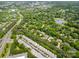 Aerial shot of neighborhood surrounded by lush greenery, near to a golf course and a highway at 14457 Adair Manor Ct, Charlotte, NC 28277