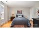 Cozy bedroom with a window, comfortable bed, and warm lighting, creating a peaceful and inviting atmosphere at 14457 Adair Manor Ct, Charlotte, NC 28277