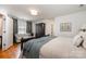 Cozy bedroom suite with sitting area, neutral tones, and soft natural light at 14457 Adair Manor Ct, Charlotte, NC 28277