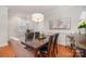 Elegant dining room featuring a stylish chandelier and hardwood floors at 14457 Adair Manor Ct, Charlotte, NC 28277
