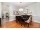 Elegant dining room featuring a stylish chandelier and hardwood floors at 14457 Adair Manor Ct, Charlotte, NC 28277