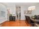 Elegant dining room with hardwood floors and decorative lighting, flowing into an open kitchen at 14457 Adair Manor Ct, Charlotte, NC 28277
