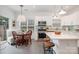Modern kitchen with stainless steel appliances, island with seating, and light backsplash at 14457 Adair Manor Ct, Charlotte, NC 28277
