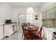 Bright kitchen nook with breakfast table and bench seating, flooded with natural light at 14457 Adair Manor Ct, Charlotte, NC 28277