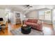 Comfortable living room with a pink sofa, an ottoman, and natural light from the large window at 14457 Adair Manor Ct, Charlotte, NC 28277