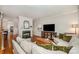Cozy living room featuring a beautiful marble fireplace and hardwood floors at 14457 Adair Manor Ct, Charlotte, NC 28277