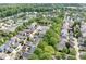 An aerial view of the community showcasing its well-maintained homes and lush green landscaping, with mature trees throughout the neighborhood at 14541 Holly Springs Dr, Huntersville, NC 28078