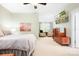 This open-concept bedroom transitions to a comfortable sitting area, and features a TV and dresser at 14541 Holly Springs Dr, Huntersville, NC 28078