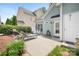 Spacious backyard patio with lounge chairs, table, grill, and a private outdoor space at 14541 Holly Springs Dr, Huntersville, NC 28078