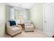 This sitting area offers two armchairs and a side table, perfect for relaxation at 14541 Holly Springs Dr, Huntersville, NC 28078