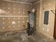 Unfinished basement space, revealing mechanical components at 1507 Rumstone Ln, Charlotte, NC 28262