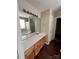 Bathroom with a long vanity, large mirror, and a separate tub and shower area at 1507 Rumstone Ln, Charlotte, NC 28262