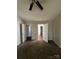 Bedroom with carpeted floors, neutral walls, and connecting doorways at 1507 Rumstone Ln, Charlotte, NC 28262