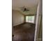 Bedroom featuring a ceiling fan, neutral walls, and natural light from a large window at 1507 Rumstone Ln, Charlotte, NC 28262