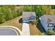 Aerial view of a two-story home with a two-car garage, porch, and well-manicured yard at 1578 Whitman Ct, York, SC 29745
