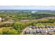Stunning aerial view of a residential community surrounded by lush forests and a tranquil lake at 1578 Whitman Ct, York, SC 29745