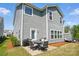Backyard featuring a patio with outdoor seating and a well-maintained lawn at 1578 Whitman Ct, York, SC 29745