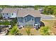 Aerial view of a spacious backyard with a patio, well-maintained lawn, and privacy fencing at 1578 Whitman Ct, York, SC 29745