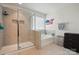 Bright bathroom featuring walk-in shower, soaking tub, and decorative wall accents at 1578 Whitman Ct, York, SC 29745