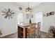 Eat-in kitchen area features a dining table and chairs next to a sunlit window and stylish decorations at 1578 Whitman Ct, York, SC 29745