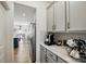 Contemporary kitchen with gray cabinets and stainless steel appliances view from a breakfast nook at 1578 Whitman Ct, York, SC 29745