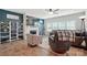 Comfortable living room with a fireplace, a large television, shelving, and wood flooring at 1578 Whitman Ct, York, SC 29745