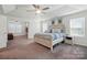 Spacious main bedroom featuring a tray ceiling, ample natural light, and en-suite bathroom access at 1578 Whitman Ct, York, SC 29745