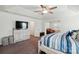 Main bedroom featuring tray ceiling, walk-in closet, ensuite bathroom, and bright natural light at 1578 Whitman Ct, York, SC 29745