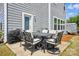 Charming patio area with outdoor dining set, grill, and access to the home's exterior, perfect for entertaining at 1578 Whitman Ct, York, SC 29745