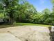Lush backyard showcasing a large grassy area and concrete patio at 1620 Matthews Dr, Rock Hill, SC 29732