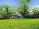 Lush backyard featuring a well-maintained lawn, mature trees and house at 1620 Matthews Dr, Rock Hill, SC 29732
