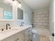 Bathroom showcasing double vanity, marble countertops, and a tiled shower-tub combination at 1620 Matthews Dr, Rock Hill, SC 29732