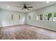 Spacious bedroom with light walls, wood floors, modern ceiling fan and natural light at 1620 Matthews Dr, Rock Hill, SC 29732
