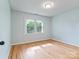 Bedroom with hardwood floors, neutral paint, and two large windows providing natural light at 1620 Matthews Dr, Rock Hill, SC 29732