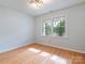 Bedroom with hardwood floors, neutral paint, and a large window providing natural light at 1620 Matthews Dr, Rock Hill, SC 29732