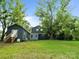 Exterior view of a two-story home with a large yard and mature trees at 1620 Matthews Dr, Rock Hill, SC 29732