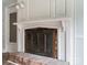 Close-up of living room fireplace with brick hearth and classic mantel at 1620 Matthews Dr, Rock Hill, SC 29732
